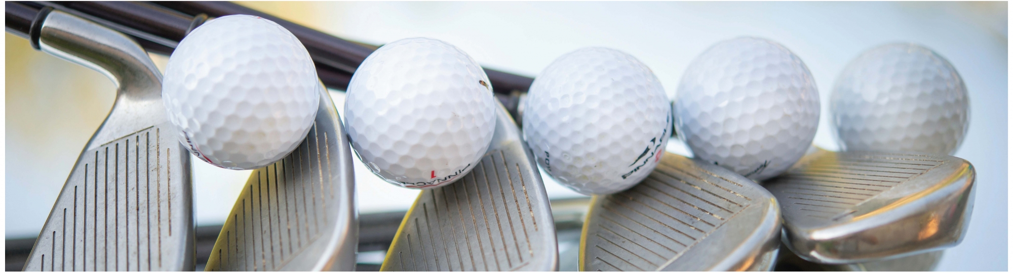 Image of golf clubs and balls